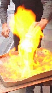 The ancient cooking technique that still erupts with heat and spectacle