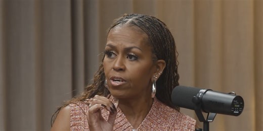 Michelle Obama Pairs a Bold Cropped Sweater Vest With Oversized Hoop Earrings