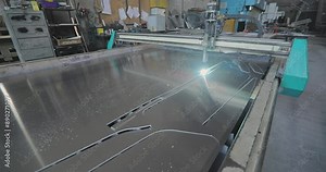 The work of a plasma cutter close-up. A plasma cutter cuts a detail, close-up. The work of the CNC plasma cutter