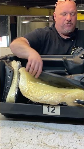 What happens when a motorcycle seat arrives at Atomic Cycle Works Garage?