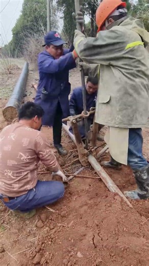 Pipeline Workers in Action! Team Installing Underground Pipes