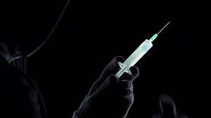 Dealer preparing to inject to client portion of strongest narcotic substance