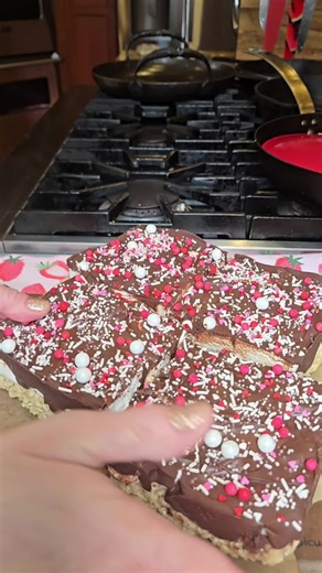 these are so easy and delicious and people go crazy for them!! fun to decorate for all holidays with all the different sprinkles. I love Deb it's mint and kitchens brown butter rice krispie recipe, but you can use whichever one you like. I usually do a 9 x 13 pan and it takes about one and a half bags of chocolate chips to cover that. you can use milk or dark chocolate, or a combination like I did this time. you will be 2 full bags of large marshmallows for a 9x13 pan. #easyrecipe #nobakedessert