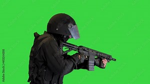 Police anti terrorism squad fighter shooting from rifle on a Green Screen, Chroma Key.