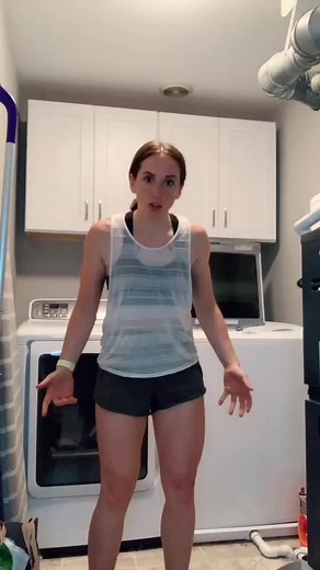 Woman Climbing into a Washing Machine for Fun