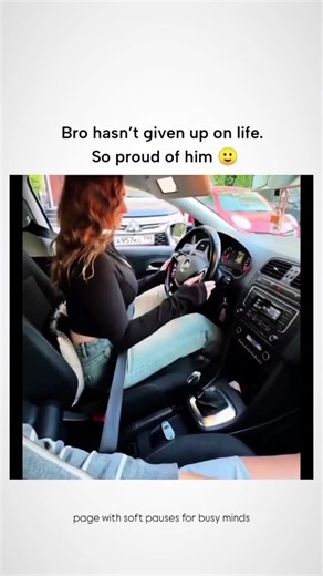Explainer® on Instagram: "The short, humorous video shows a nervous woman attempting her first (or early) driving lesson in what appears to be an automatic car. She fumbles badly with the basics — struggling to properly fasten her seatbelt (which ends up buckled into the passenger side instead), leaving the handbrake engaged while trying to move, and clearly panicking as the car barely creeps forward. Throughout the chaos, her calm male passenger (likely boyfriend or husband) patiently reaches o