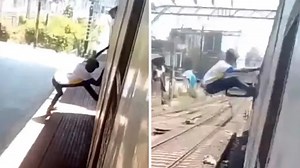 Jaw-dropping daredevil hangs from moving train in thrilling stunt
