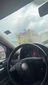This driver pulled over to let a fire truck pass, not noticing that their window was down and a large puddle was nearby. As the truck sped by, it splashed water straight into the car, soaking the interior. | Jukin Copyright Management