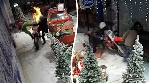 Moment thieves steal motorbikes from garage's Grinch window display