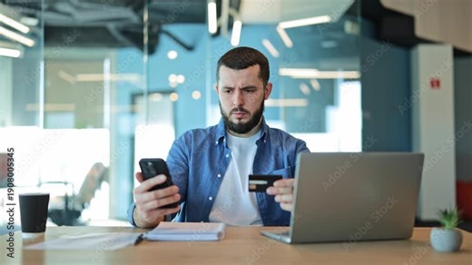 Anxious individual experiences financial concern disappointment during a failed online payment using credit card and smartphone. Reflects modern digital transaction problems and potential debt issues.