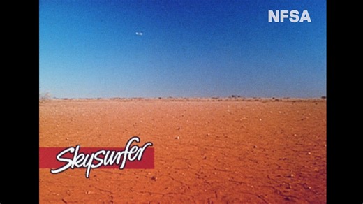 Extreme sweat, Aussie daredevils and the red heat of the outback. Has anything ever made a bottle of Coke look more refreshing? Dive back into this outrageous moment in Australian advertising with an ad that could only be forged in the 90s. In 1991, Coca Cola launched the first Australia-created commercial to air worldwide with a bold premise: a group of men leap out of a plane on surfboards in a quest to quench their thirst. Filmed in Broken Hill, the same shooting location of the ‘Mad Max’ fil