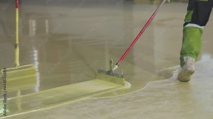 Applying self-leveling floor to the surface. How to create a self-leveling floor. Creating a self-leveling floor.