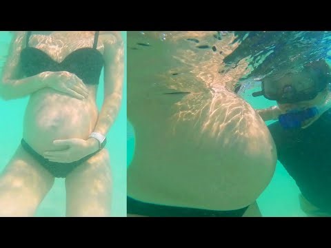 Pregnancy Photoshoot Underwater in Sea highlighting Huge Pregnant Belly