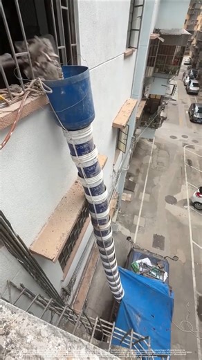 Genius or Crazy? The DIY skyscraper trash slide!