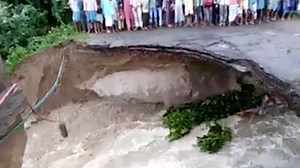 220K views · 265 reactions | This is the heart-wrenching moment a mother and daughter fell when a bridge collapsed due to an overflowing river in India. | Storytrender | Facebook