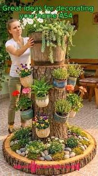 The flower baskets are hung on the tree. #reusable materials #plastic cans #creative #diy