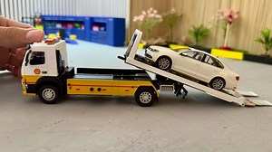 Volvo Transports Volkswagen Jetta Diecast Model Car on Transporter