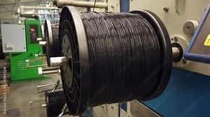Bobbin winding machine. Detail from a spool with plastic filament Stock Video