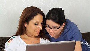 clip-3186418-daughter-showing-mother-how-use-computer