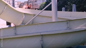 Old, abandoned water slide, view of a closed water slide on a cold spring day