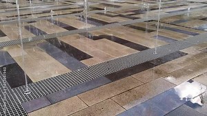 running fountain in the summer. Global warming, rescue from the heat by fountains