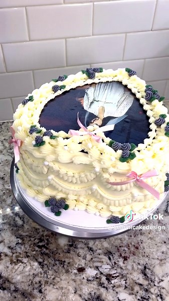 I love this pic of Lana so much! I think this is my fav Lana cake I’ve done 🤍 Once orders slow down a little I want to get back to doing full decorating videos! I miss them so much 🫶🏻 @Lana Del Rey #buttercream #buttercreamcake #cake #cakedecorating #cakedesign #wiltontips #wiltoncakes #austintx #austintexas #austin #texascakes#cakesofinstagram #austincakes#buttercreamdecorating #heartcake #pearlcake #birthdaycake #vintagecake #shellborder #rufflecake #ediblepearls #y2kcake #shellborder #butt