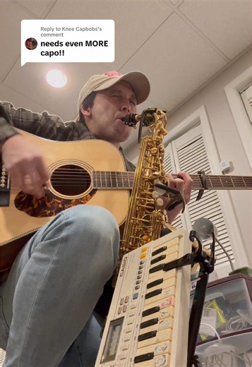 One-Man Band Performance: Saxophone and Acoustic Guitar