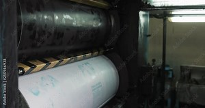 Printing machine. Large paper roll print machine in production