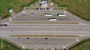 Aerial view of highway rest area with cafe and car park for cars and trucks Top view of highway infrastructure, 4k Stock Video