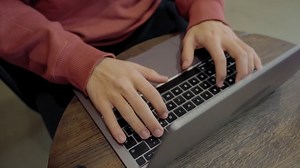Young man typing on a laptop - Free Stock Video Footage | Coverr