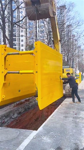 Enhancing Trench Safety: Installing a Large Yellow Trench Shield