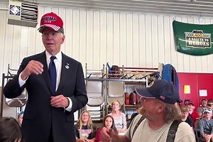 Biden Briefly Put on a Trump Hat, and MAGA World Flipped Its Lid