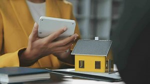 Download Real estate broker agent presenting and consult to customer to decision making sign insurance form agreement, buy and sell home model, concerning mortgage loan offer for and house insurance for free