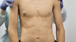 A Pediatric Doctor Does a Body Examination of a Teenager. he Checks the Baby`s Skin Stock Video - Video of examining, listening: 131586505