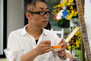 Okinawa man from Japan eats a bowl of soup with a spoon and pretty...