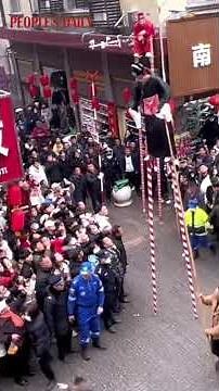 Stilt walkers on 5-meter-high stilts perform the traditional Chinese pastime