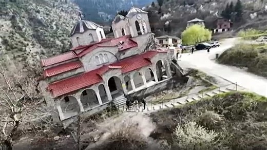Tourists test balance inside tilted church in Greece’s Ropoto