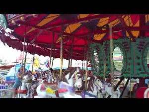 Layla on her first Anoka County Fair Merry Go Round ride 2010
