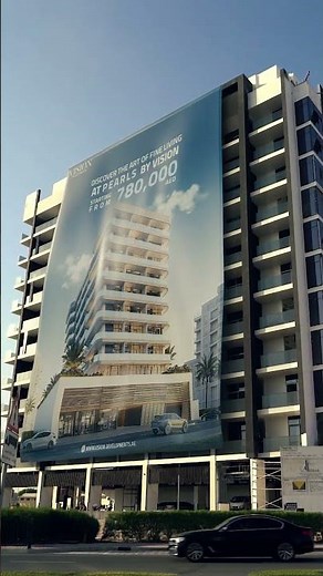 Real or CGI? Huge Roll-Up Banner Spreads Over Building