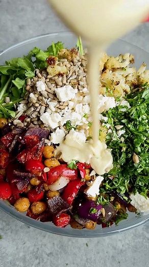 RAINBOW VEGGIE ORZO SALAD WITH CREAMY LEMON-FETA DRESSING! This dressing is velvety and freaking delicious! You will only need half-ish of the dressing for the salad—save the rest because you will love it! • For the veggies: 1 head cauliflower, cut into small florets 1 large red bell pepper, chopped 1 red onion, chopped 1 15 oz can chickpeas, rinsed and drained 3-4 tbsp olive oil 2 tsp dried oregano 2 tsp dried dill 1 tsp salt 1 tsp garlic powder 1/2 tsp pepper • For the salad: 8 oz orzo, cooked