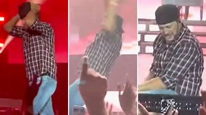 Luke Bryan totally owns the moment after he slips and falls on stage
