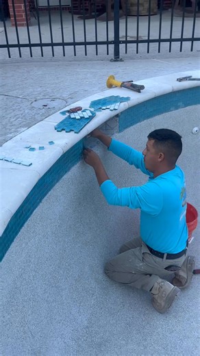 In Vidor today installing this beautiful 5cm travertine coping and turquoise glass tile. 😻 | 123 Pool Renovations