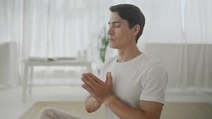 Man in peaceful mind meditation at home - Free Stock Video