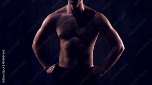 man with perfect biceps and triceps demonstrating muscles after hard training