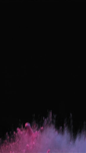 Blue and pink powders exploding in a vibrant and colorful shot - Free Stock Video