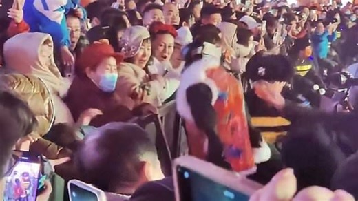 Moment security drags away humanoid robot after it 'attacks' crowd