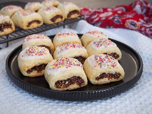 Ready to plan some Holiday baking? These cucidati cookies have a delicious fruit filling wrapped in a buttery cookie, topped with lemon frosting & sprinkles. Delicious! https://www.carolinescooking.com/cucidati-italian-fig-cookies/ | Caroline's Cooking