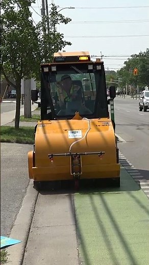 The Trackless Pickup Sweeper clears sidewalks fast!