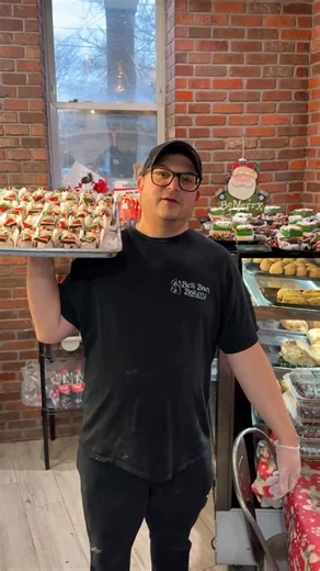 🎄✨ Merry Christmas from all of us at Belli Baci Bakery! ✨🎄 It’s been a crazy busy week filled with cookies, cakes, and lots of holiday cheer. In the middle of it all, Ernie tried to say “Merry Christmas” in our video… but between the ovens going and orders flying out the door, it didn’t quite come out clearly 😄 Just know it was said with a full heart ❤️ Thank you to everyone who supported us this season — we’re so grateful for each and every one of you. Wishing you a sweet, happy, and peacefu