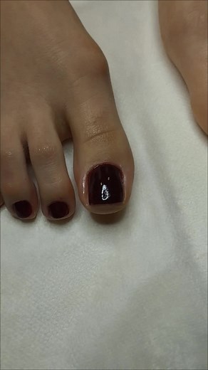 Beautifully Manicured Toes with Dark Red Nail Polish